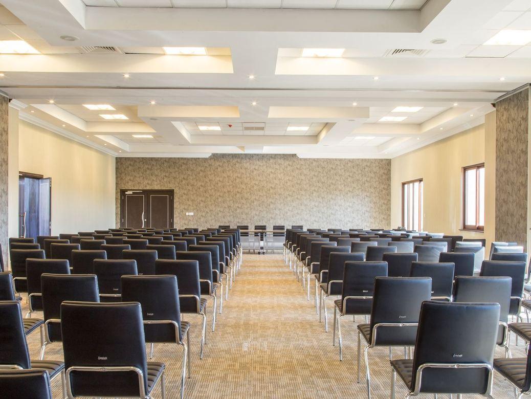 Large room set up with rows of chairs